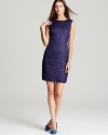 With a subtle reptilian texture at the front and a smooth knit back, T Tahari's Cali dress is a study in cool contrasts.