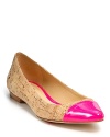 A shocking neon cap toe lends fashionable wit to the Elina flats, constructed in lightly metallic cork. From kate spade new york.