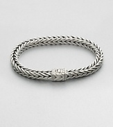 Small sterling silver bracelet in a squared, rope-weave pattern resembling herringbone, with push-lock closure.Sterling silverAbout 3 diam.Imported