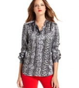 MICHAEL Michael Kors elevates this sleek petite blouse with a snakeskin print and a shimmering chain threaded through the collar.