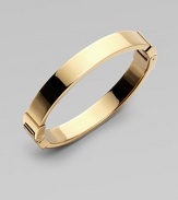 A thin goldtone design with hinge closure, perfect for stacking. Goldtone steelDiameter, about 2¾Hinged closureImported 
