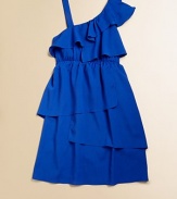 Cascading ruffles in a sleek, one-shoulder silhouette will make this frilly frock her go-to choice every time.Asymmetrical necklineRuffled one-shoulder with strapPullover styleElastic waistbandFull skirtPolyesterHand washMade in the USA of imported fabric
