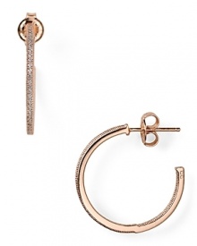 With a crystal-encrusted rim, Chrislu's rose gold-finished hoop earrings are a classic choice whether worn with denim or more swank with a little black dress and heels. With a crystal-encrusted rim, Chrislu's rose gold-finished hoop earrings are a classic choice whether worn with denim or more swank with a little black dress and heels.