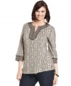 Infuse a global feel to your casual wardrobe with Karen Scott's three-quarter-sleeve plus size top, featuring a mixed print.