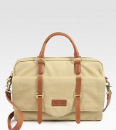 Both trim and roomy, in rugged leather-trimmed canvas, perfectly sized to protect your computer and hold a few other essentials as well.Double top handlesDetachable padded shoulder strapTop zip closeOutside buckle-strap flap pocketInside computer compartment and zip pocketCotton lining15W X 10H X 2DImported