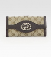 Signature jacquard with rich logo-stamped Guccissima leather trim in a classic continental silhouette, finished with polished GG hardware.Flap and snap closureOutside snap coin pocket Two inner bill compartmentsSeven credit card slotsLeather lining7½W X 3½H X 1DMade in Italy