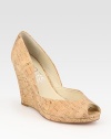 Low-cut peep toe in wonderfully textured cork, grounded by a substantial wedge. Cork wedge, 3½ (90mm)Cork upperLeather lining and solePadded insoleImported