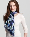 A chic oblong silk scarf with large floral Ganini print all over from Salvatore Ferragamo.