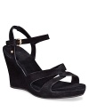 Soft suede straps, twisted at the toe and buckled at the ankle, perch on a comfortable wedge.