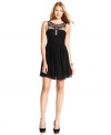 BCBGMAXAZRIA's enchanting silk dress dazzles with luxe beading on a sheer inset at the chest.