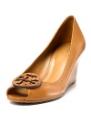 Classic pebbled leather peeptoe wedge sandals with tonal logo ornamentation at toe.