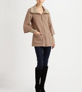 The definition of chic luxury, this cold-weather piece features stylish cable-knit details, convenient patch pockets and a phenomenal fit. Cable-knit collar and cuffsLeather detail at front zipperPatch pocketsAbout 30 from shoulder to hem80% wool/20% viscoseDry clean by leather specialistImported Model shown is 5'11 (180cm) wearing US size Small. 