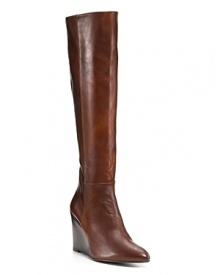 Chic and slim, these rich leather wedges are autumn's go-with-anything boot. By Stuart Weitzman.