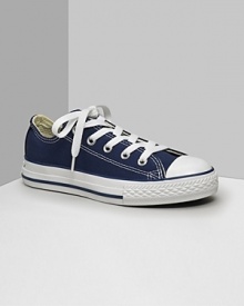 Low cut Converse All Stars. This classic canvas sneaker set the standard in cool and comfort. Available in kids sizes. With lace-up canvas uppers, contrast stitching and rubber sole and toe. Low cut Converse All Stars. This classic canvas sneaker set the standard in cool and comfort. Available in kids sizes. With lace-up canvas uppers, contrast stitching and rubber sole and toe.