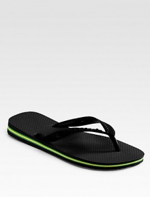 A super-comfortable rubber flip flop to wear all summer long with the colors of Brazil along the sides. Logo detail on strap Made in Brazil Women's Sizes Please note that men's sizes are listed below. If you wear women's size 7-8 order size 6; 9-10 order size 7-8; 11 order size 9. A super-comfortable rubber flip flop to wear all summer long with the colors of Brazil along the sides. Logo detail on strap Made in Brazil Women's Sizes Please note that men's sizes are listed below. If you wear women's size 7-8 order size 6; 9-10 order size 7-8; 11 order size 9.