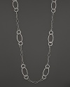 Beautifully textured sterling silver links, in oval and circle shapes, form a dramatic necklace. From the John Hardy Bedeg collection.