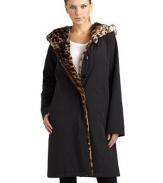 THE LOOKHooded styleLeopard printed faux fur liningConcealed snap frontLong sleevesDual side pocketsTHE FITAbout 37 from shoulder to hemTHE MATERIALShell: polyesterFaux fur: acrylic/polyesterFill: polyesterLining: nylonCARE & ORIGINDry cleanImportedModel shown is 5'11 (180cm) wearing US size Small. 
