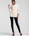 A chunky ribbed cowlneck and cable knit detail lend luxe to this chic sweater from C by Bloomingdale's.
