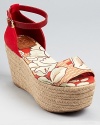 A pretty floral print adds summery style to Tory Burch's Sherri espadrilles, boasting the season's coveted flatform silhouette.