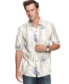 Purvey a taste of the tropics with this sophisticated lounge shirt from Tommy Bahama.