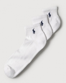 Polo Ralph Lauren set of three stretch cotton quarter socks feature a cushioned foot and ribbed top. Polo player embroidered detail. Three pairs of socks per set.