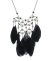 Definitely dramatic. A distinctive combination of black feathers and faceted crystal flower accents makes Haskell's statement necklace stand out in a crowd. Crafted in hematite tone mixed metal. Approximate length: 18 inches + 3-inch extender. Approximate drop: 5-1/2 inches.