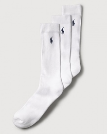 Polo Ralph Lauren set of three stretch cotton crew socks feature a cushioned foot and ribbed top. Polo player embroidered detail. Three pairs of socks per pair.