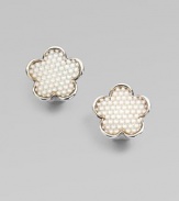 This sweet and simple, sterling silver stud is embellished with pretty mother-of-pearl stones. Mother-of-pearlSterling silverSize, about ¾Post backImported 