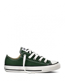 Go green with these classic Converse sneakers featuring a the quintessential All Stars rubber sole with sporty black stripes. Go green with these classic Converse sneakers featuring a the quintessential All Stars rubber sole with sporty black stripes.