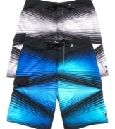 Get graphic. Whether you're hitting the beach or the streets, these Hurley board shorts turn the volume up on your sweet surfer style.
