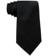 Ground a patterned shirt. This solid tie from Calvin Klein is the perfect companion to the season's favorite look.