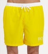 These solid swim trunks sport a drawstring waistband and the classic BOSS logo.Elastic drawstring waistSide slash pocketsPolyester liningPolyamideMachine washImported