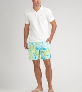 Return to the deep in this colorful tropical-print style. Drawstring/elastic waist Two side slash pockets Back flap pocket Quick-dry convenience Inseam, about 6 Mesh lining Nylon; machine wash Imported