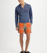 Relaxed swim trunks in a quick-drying blend of cotton and nylon with an easy fit thanks to an elastic back waistband. Shoestring waist Velcro® fly Side slash, back patch pockets Interior waistband key pocket Embroidered logo detail Mesh lining Inseam, about 6 52% cotton/48% nylon Machine wash Imported 