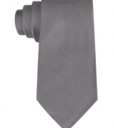 Mix it up with a touch of texture. This slim corduroy tie from Calvin Klein does gives your look a modern twist.
