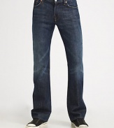 Classic five-pocket Italian cotton denim in New York wash, a dark blue with fading and whiskering details. Zip fly Slim-fit narrows at knee, opens to bootcut hem Signature squiggle stitching on back pockets Inseam, about 33¼ Cotton Machine wash Made in USA