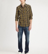 Gently distressed, lightly faded in an updated slim silhouette. Five-pocket styleInseam, about 34CottonMachine washImported