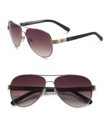 Classic aviator style gets a chic update in goldtone metal with signature Tory logo at temple. Available in gold with smoke gradient lens. UV 400 lens 100% UV protection Imported 