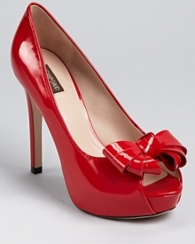 A shoe for the true femme fatale, Joan & David's Cutie pump boasts a lipstick red hue.