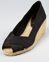 In silk shantung, these Lauren Ralph Lauren espadrilles are the ultimate in practicality--perfect for both day and night and equipped with a modern wedge heel.