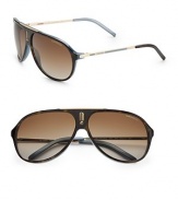 An acetate style with logo emblem at bridge. Available in black palladium with gray polor lens or havana blue/gold with brown polar lens. Logo temples 100% UV protection Imported 