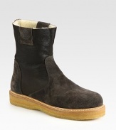 Elegant suede design, with contrasting rubber sole and cozy shearling lining.Leather upperRubber soleMade in Italy