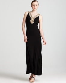 With an embellished neckline and a fluid black silhouette, this Calvin Klein maxi dress will take your look in an elegant direction. Team with sandals and gold accents for goddess-like glamour. With an embellished neckline and a fluid black silhouette, this Calvin Klein maxi dress will take your look in an elegant direction. Team with sandals and gold accents for goddess-like glamour.