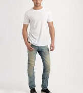 Deeply faded and distressed throughout the leg, this slim-fitting jean exudes effortless style with an edgy, downtown feel.Five-pocket styleInseam, about 33CottonMachine washMade in Italy
