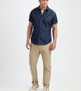This trim-fitting cotton denim style works well on weekends, the perfect alternative to a polo.Point collarButton front Short sleevesShirttail hemCottonMachine washImported