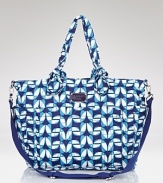 For the haute stroller mom, MARC BY MARC JACOBS' nylon baby bag is an ultra-cute essential. With plenty of pockets and a poppy print, this playful tote keeps your little one's essentials stowed in designer fashion.