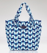 This season, MARC BY MARC JACOBS' classic quilted tote makes a graphic statement. Perfectly sized for everyday, this nylon bag punches up day-to-day basics.
