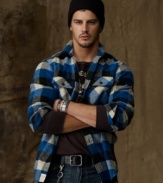 Designed in a plaid wool, the long-sleeved shirt is tailored for warm, casual style.