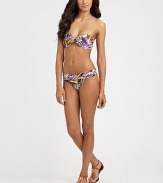 A vivacious design featuring an intoxicating butterfly print, complemented exquisitely by a sexy, gilded center ring. Bandeau topMolded cupsGold center ringBack tie closureFully lined85% polyamide/15% spandexHand washImported Please note: Bikini bottom sold separately. 