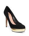 Black evening pumps get a bold boost from metallic gold platforms and heels; by VINCE CAMUTO.